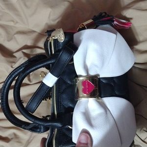 Betsey Johnson purse, has tag, never, damage to handle as shown